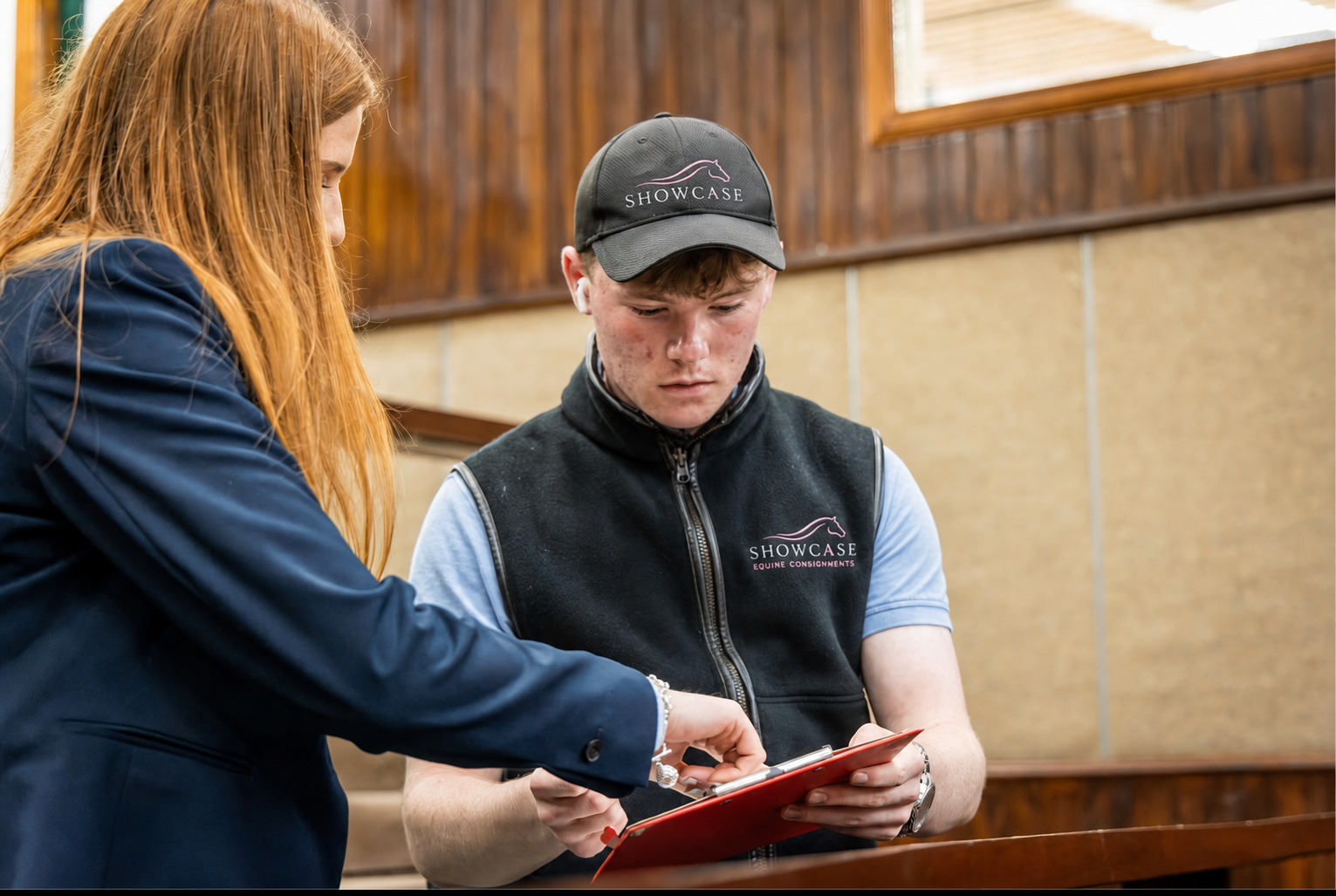Handler leading a horse in the sale ring